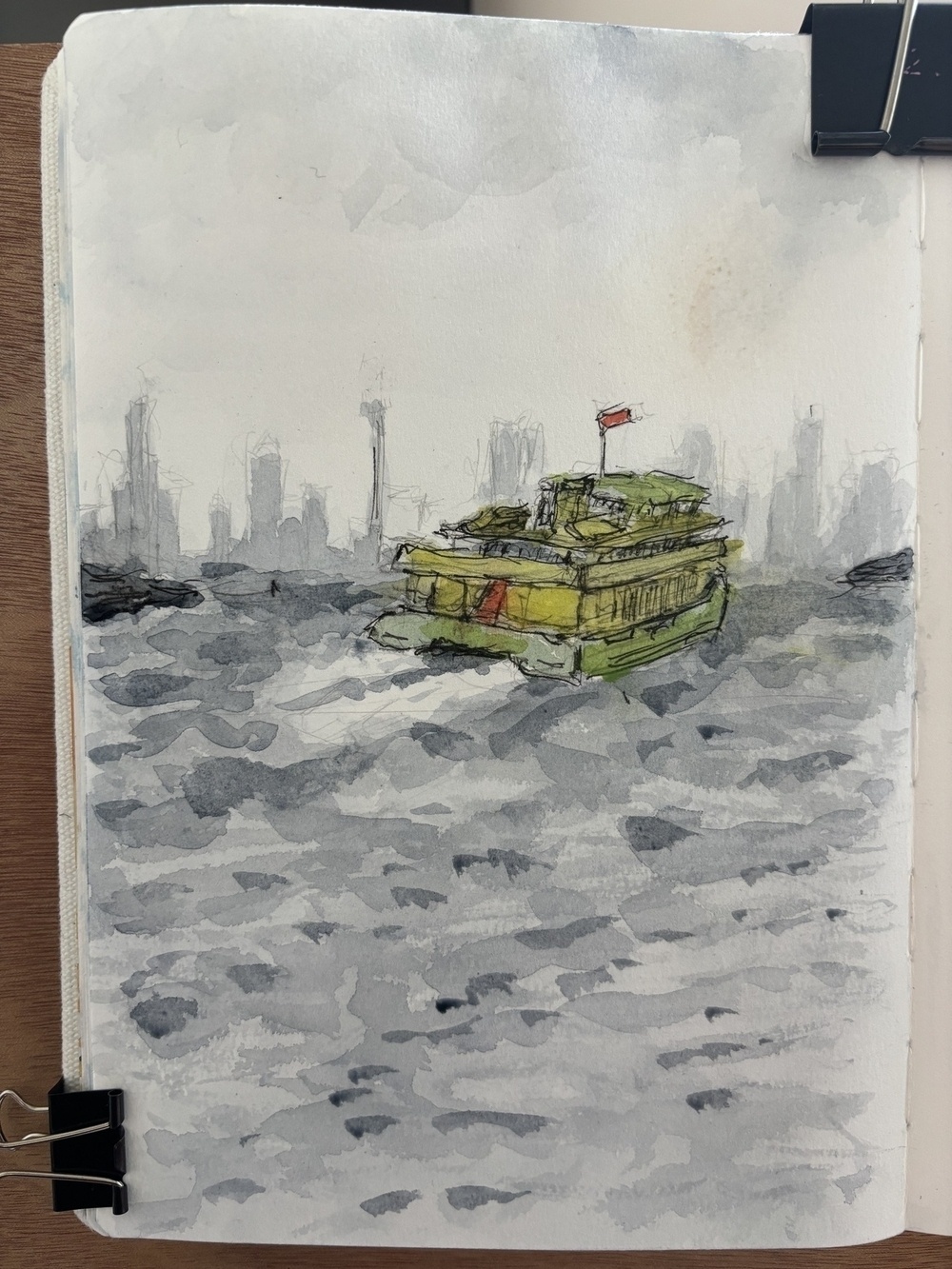 ‘A yellow and green Sydney ferry on a stormy day’